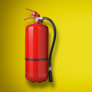 a red fire extinguisher on a yellow background