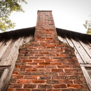 a group-up view of a masonry chimney